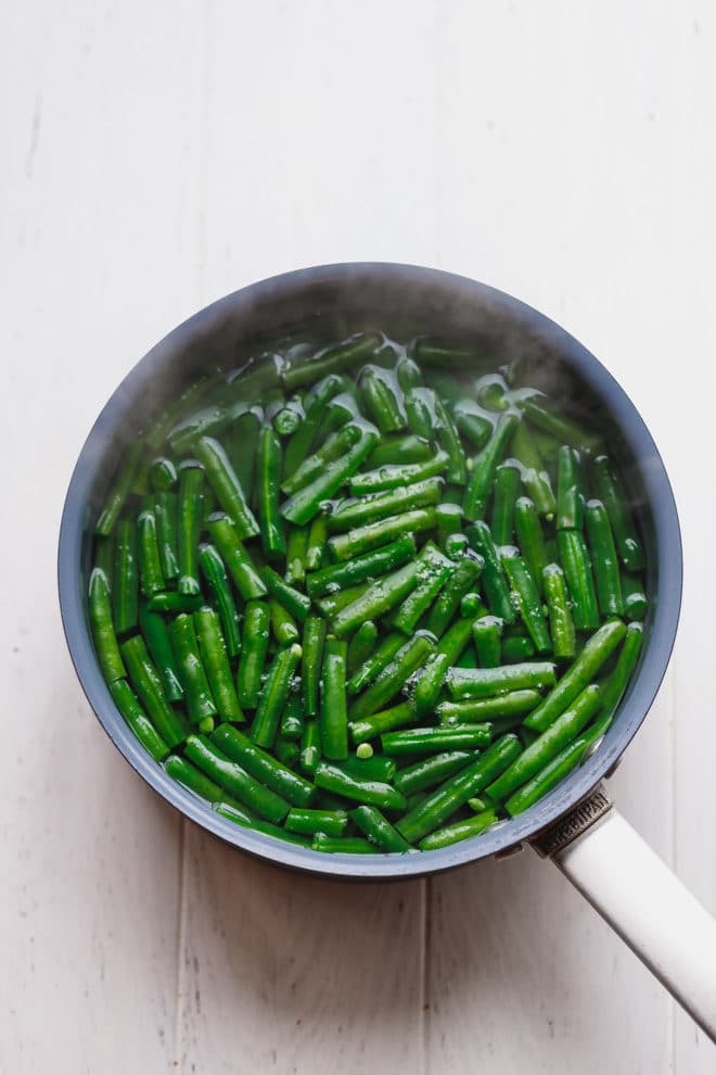Green beans in a pot of hot water