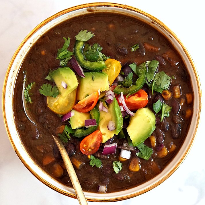 This easy vegetarian and vegan black bean soup is so easy to make in the slow cooker! 