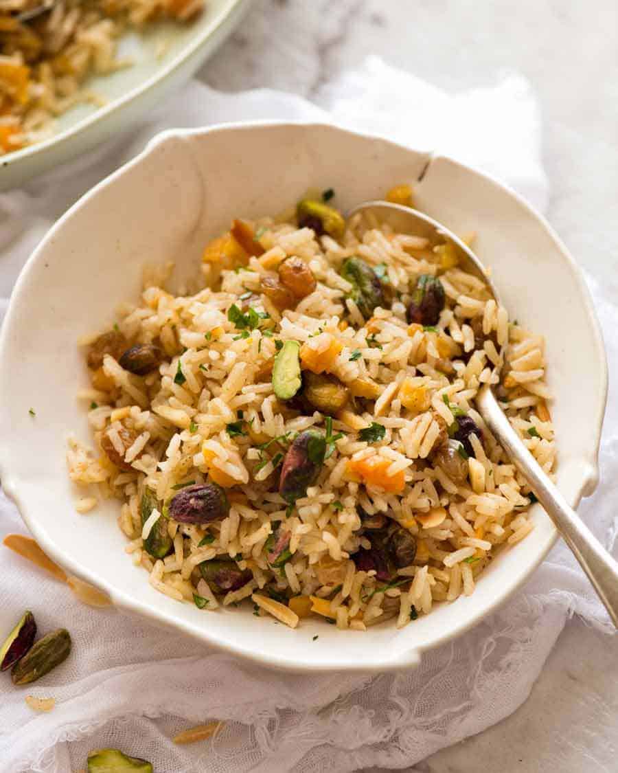 Rice Pilaf in a bowl with a spoon, ready to be eaten